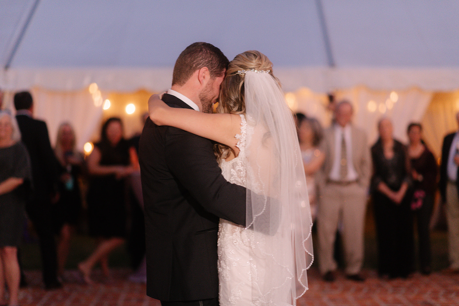Bride and Groom Embracing during First Dance