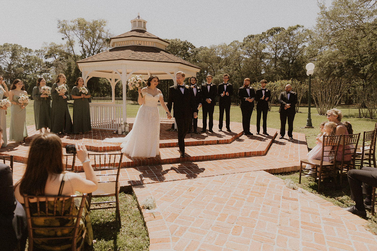 Bride & Groom Walking Hand in Hand After Wedding Vows