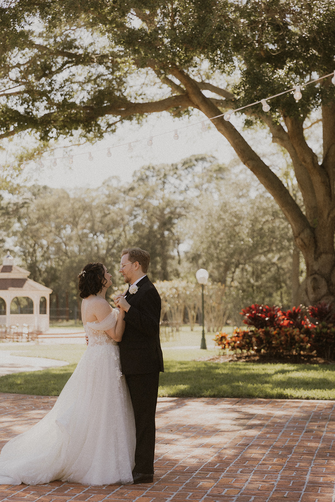 Bride and Groom dancing under the trees