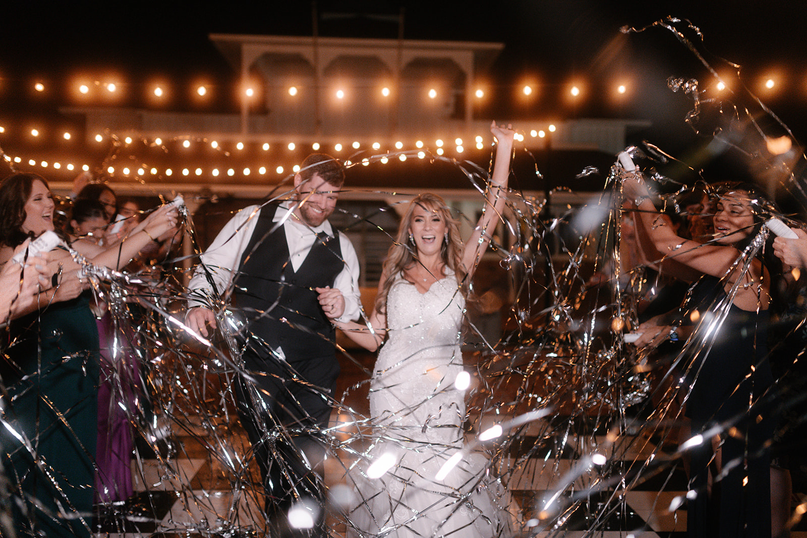 wedding guests celebrating with bride and groom