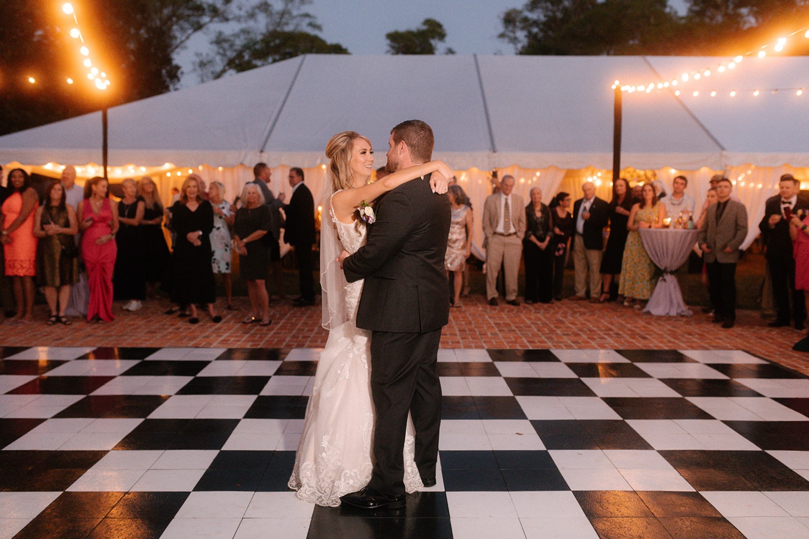 Bride and Groom Embracing on a Dance Floor