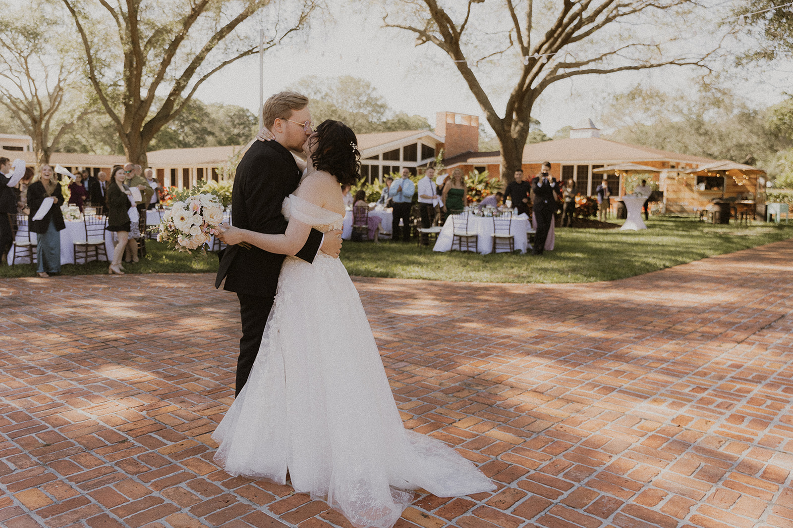 Bride and Groom Kissing on the Dance Floor