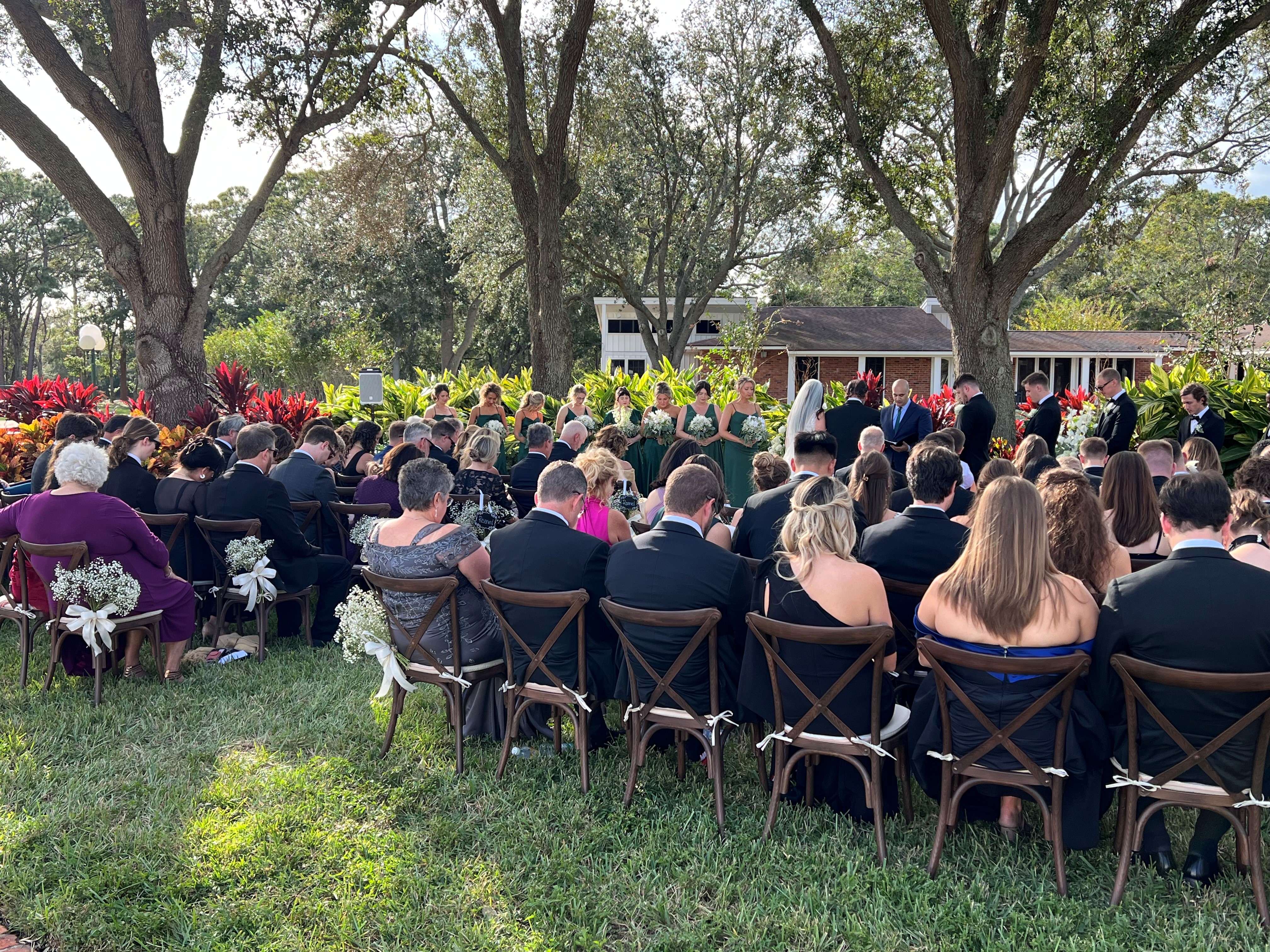 Wedding ceremony under lush trees