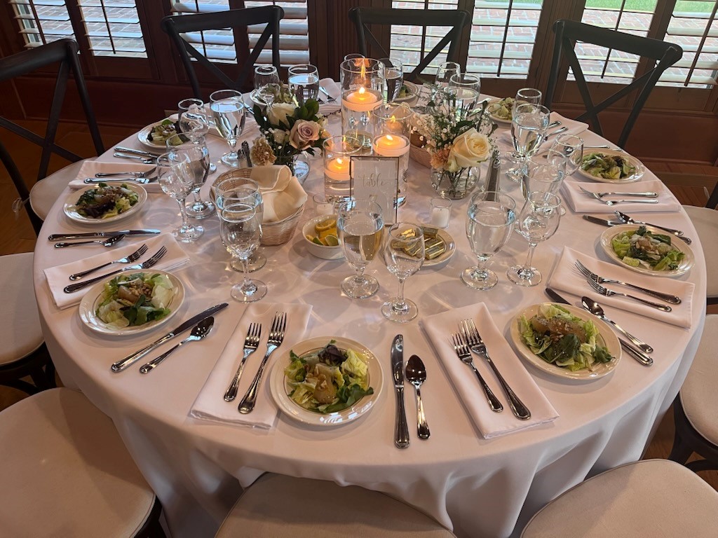 Beautiful table setting with floating candles and neutral flowers